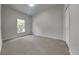 Cozy bedroom with neutral carpet, a window, and a closet at 130 Circle Hill Rd, Sanford, FL 32773