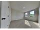 Well-lit bedroom featuring neutral carpet, two windows, and a closet at 130 Circle Hill Rd, Sanford, FL 32773