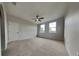 Spacious bedroom with neutral carpet, a ceiling fan, and two windows for ample natural light at 130 Circle Hill Rd, Sanford, FL 32773