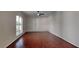 View of the living room featuring hardwood floors and a large arched window at 130 Circle Hill Rd, Sanford, FL 32773