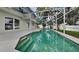 Backyard pool with screened-in enclosure and lush greenery at 130 Circle Hill Rd, Sanford, FL 32773