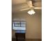 Well-lit room with a ceiling fan and a window providing natural light at 130 Jasmine Woods Ct # 6D, Deltona, FL 32725