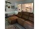 Inviting living room featuring a comfortable couch and seamless flow into the kitchen area at 130 Jasmine Woods Ct # 6D, Deltona, FL 32725