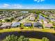 Aerial view of property with lake view and lush landscaping at 13606 Summer Rain Dr, Orlando, FL 32828