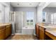 Bathroom features a tub, shower, and double sink vanity at 13606 Summer Rain Dr, Orlando, FL 32828