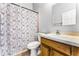 Bathroom features a shower and vanity with a white sink at 13606 Summer Rain Dr, Orlando, FL 32828
