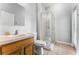 Bathroom featuring a single vanity, toilet, and walk-in shower at 13606 Summer Rain Dr, Orlando, FL 32828