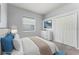 Bedroom with neutral décor, large closet, window and comfortable bed at 13606 Summer Rain Dr, Orlando, FL 32828