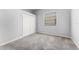Neutral bedroom featuring a large closet and window providing natural light at 13606 Summer Rain Dr, Orlando, FL 32828