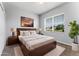Cozy bedroom with large window and calming decor at 13606 Summer Rain Dr, Orlando, FL 32828