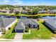 Lovely single-Gathering home with lush green lawn, attached garage and a picturesque waterfront view in a serene setting at 13606 Summer Rain Dr, Orlando, FL 32828