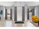 Elegant foyer featuring tile flooring, high ceilings, and bright windows with curtains at 13606 Summer Rain Dr, Orlando, FL 32828