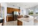 Kitchen with stainless steel appliances, ample counter space and wood cabinetry at 13606 Summer Rain Dr, Orlando, FL 32828