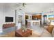 Open-concept living space with modern furnishings, neutral tones and tiled floors at 13606 Summer Rain Dr, Orlando, FL 32828