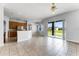 Spacious living space featuring tile flooring and sliding glass doors to the outdoors at 13606 Summer Rain Dr, Orlando, FL 32828