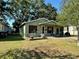 Charming single-story home with a well-manicured lawn and a covered porch, creating a welcoming curb appeal at 1404 Davidson St, Orlando, FL 32804