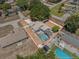Aerial view of a home showcasing a screened pool, fenced yard, and surrounding neighborhood at 150 Bentley Oaks Blvd, Davenport, FL 33896