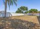 Spacious backyard featuring a well-maintained lawn and privacy fence at 150 Bentley Oaks Blvd, Davenport, FL 33896