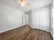 Bedroom with hardwood floors, a ceiling fan, a closet, and a door at 150 Bentley Oaks Blvd, Davenport, FL 33896
