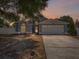 Charming single-Gathering home features a two-car garage and a well-maintained lawn at 150 Bentley Oaks Blvd, Davenport, FL 33896
