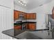 Well-equipped kitchen with granite countertops, stainless steel appliances, and ample storage space at 150 Bentley Oaks Blvd, Davenport, FL 33896