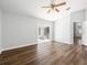 Spacious living room with hardwood floors, ceiling fan, and sliding glass doors at 150 Bentley Oaks Blvd, Davenport, FL 33896