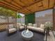 Inviting outdoor living space featuring a fire pit, comfortable seating, and a pergola at 150 Bentley Oaks Blvd, Davenport, FL 33896
