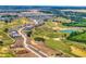 Aerial view of a beautiful community with golf course, lush landscaping, and modern homes at 16808 Bolsena Dr, Bella Collina, FL 34756