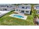 Beautiful backyard features a modern pool and patio area, perfect for outdoor relaxation and entertainment at 16808 Bolsena Dr, Bella Collina, FL 34756