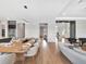 Open dining and living area boasts stylish decor and bright recessed lighting at 16808 Bolsena Dr, Bella Collina, FL 34756