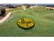 Scenic golf course with decorative flower bed and automatic sprinklers at 16808 Bolsena Dr, Bella Collina, FL 34756