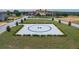 Image features a well-maintained helipad surrounded by greenery and trimmed bushes at 16808 Bolsena Dr, Bella Collina, FL 34756
