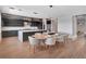 Modern kitchen open to the dining area and boasting a large island and ample seating at 16808 Bolsena Dr, Bella Collina, FL 34756