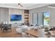 Open-concept living area with stylish furniture, a dining table, and a view of the lake, perfect for Gathering gatherings at 16808 Bolsena Dr, Bella Collina, FL 34756