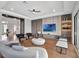 Open concept living room with custom cabinets and bright recessed lighting at 16808 Bolsena Dr, Bella Collina, FL 34756