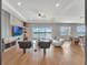 Bright, open living room with modern furniture and stunning waterfront views at 16808 Bolsena Dr, Bella Collina, FL 34756