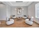 Cozy living room featuring stylish seating, contemporary lighting, and artistic decor that create a relaxing atmosphere at 16808 Bolsena Dr, Bella Collina, FL 34756