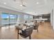 Sun-drenched living room with water views, modern décor, and an open floor plan at 16808 Bolsena Dr, Bella Collina, FL 34756