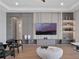 Well-lit living room featuring custom shelving, recessed lighting, and contemporary design at 16808 Bolsena Dr, Bella Collina, FL 34756