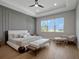 Relaxing primary bedroom features modern decor, a sitting area, and a large window with picturesque water views at 16808 Bolsena Dr, Bella Collina, FL 34756