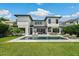 Backyard featuring a modern pool, lounge chairs, outdoor dining, and lush green lawn at 1700 Palm Ave, Winter Park, FL 32789
