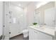 Clean bathroom features glass enclosed shower, white subway tile, and a white vanity at 1700 Palm Ave, Winter Park, FL 32789