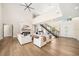 Spacious living room with high ceilings, a fireplace, and elegant white furniture at 1700 Palm Ave, Winter Park, FL 32789