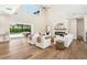 Spacious living room featuring a modern fireplace, hardwood floors, and sliding glass doors to the backyard at 1700 Palm Ave, Winter Park, FL 32789