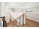 Bright staircase with modern railing, hardwood treads, and plenty of natural light at 1700 Palm Ave, Winter Park, FL 32789