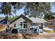 Spacious backyard with patio, hot tub, outdoor seating, and a lush, tree-lined perimeter at 1848 Jimson Ave, Ocoee, FL 34761