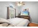 Bright bedroom with a ceiling fan, a bright window, and cozy decor at 1848 Jimson Ave, Ocoee, FL 34761