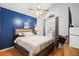 Primary bedroom with a ceiling fan, a bright window, and cozy decor at 1848 Jimson Ave, Ocoee, FL 34761