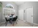 Dining area featuring a glass table and a window at 1848 Jimson Ave, Ocoee, FL 34761