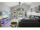 Bright living room with vaulted ceilings, lots of natural light, and sliding glass doors to the backyard at 1848 Jimson Ave, Ocoee, FL 34761